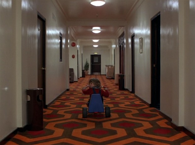 The Shining - Danny glances back at Room 237 as he cycles away