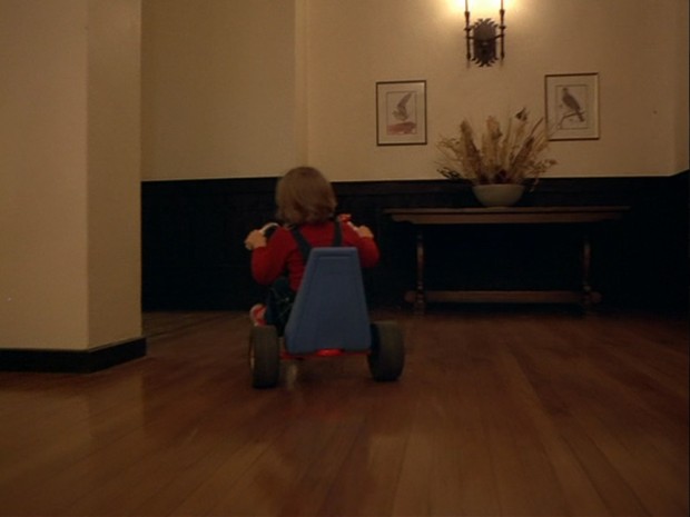 The Shining - Danny rounds a corner to enter the parallel hall again