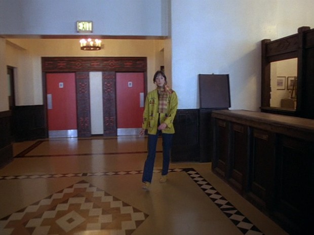 The Shining - We finally see that these red doors lead to bathrooms